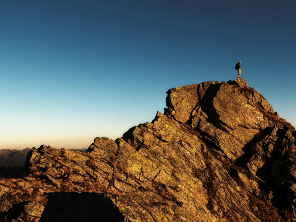 Hiker on Cliff Top